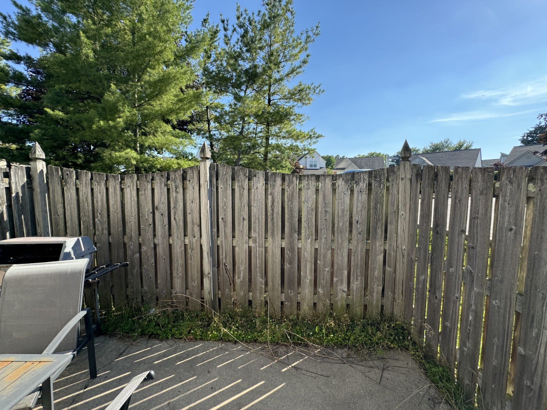 Fence before professional exterior cleaning